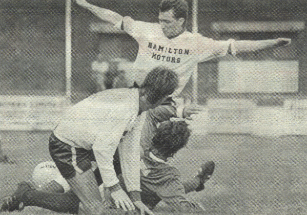 Gary Miller takes charge as John Love looks on.