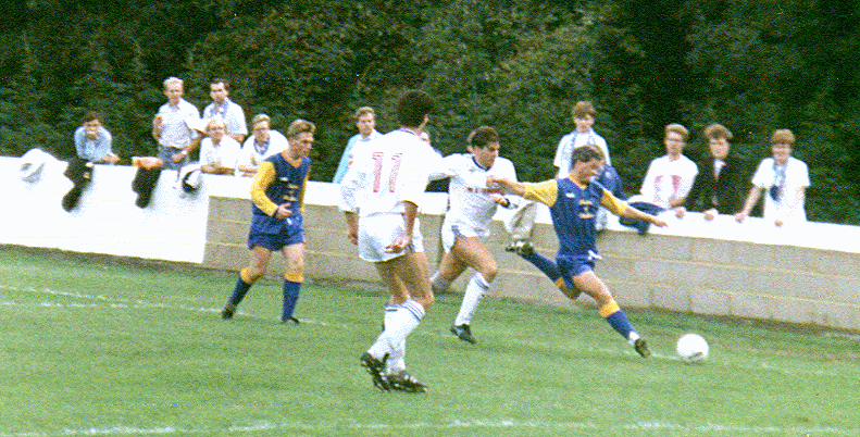 Steve Lane (number 11) looks on as Ronnie Murrock challenges for the ball in front of Margate's travelling support. The fans pictured include this website's creator - second from the right in the dark jacket.