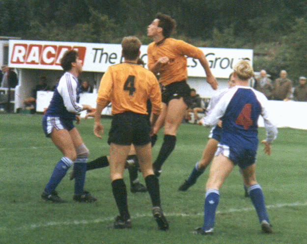 A defender heads clear as Ronnie Murrock (left) and Gary Moss (number 4) look on.