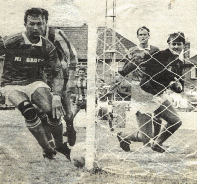 A near miss for the Rams as Brian Frampton and Joe Radford look on.