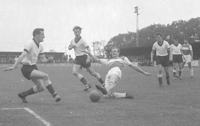 Terry Joyce on the attack with David Hills also in the picture on the right