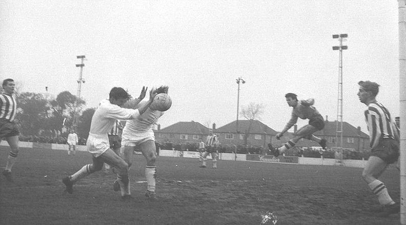 Two Margate players, one of whom may be Brian Naysmith, go for the same ball. The Ramsgate player on the left is future Margate star Bryan Clifton
