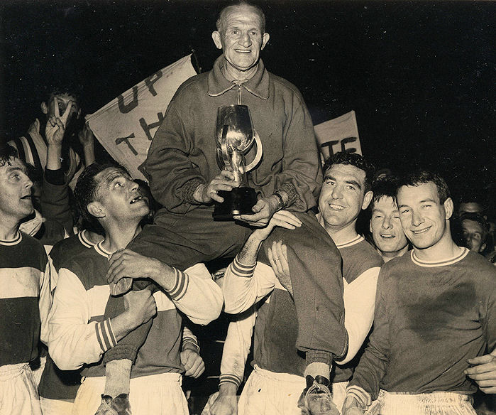 Trainer Bob Wainwright with the trophy. The players in the photo are (from the left) Terry Joyce, Bill Parry, Bob Harrop, Terry Dann and Brian Hughes.