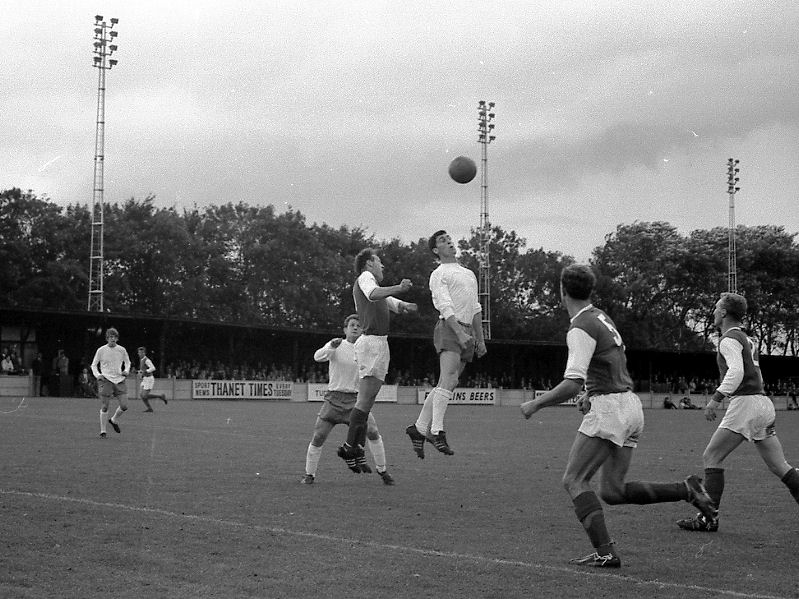 Derek Grace leaps for a high ball in front of Folkestone defender John Tredwell watched by Tommy Jenkins (left) and Gordon Burden.