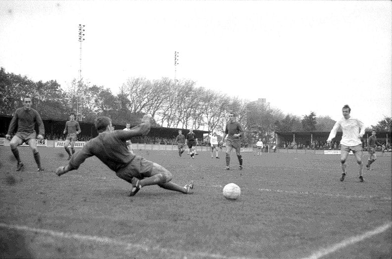 The keeper in action again with Davie Houston again the nearest Margate player.