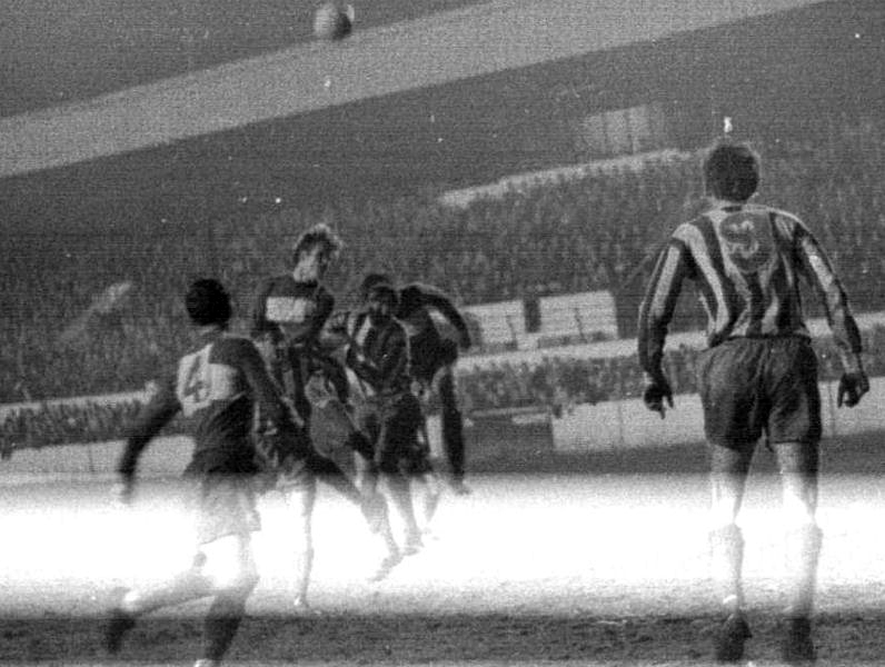 Bob Harrop and Bryan Snowdon contest a high ball.