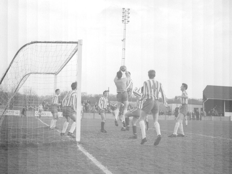 The visiting keeper claims the ball as Dennis Randall challenges. David Jarman is just to the left of the keeper in the picture.
