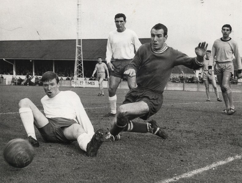 Arthur Blackley and Brian Hughes looking anxious as Bob Harrop looks on. Future Margate star Phil Amato is the Cambridge United player on the right.