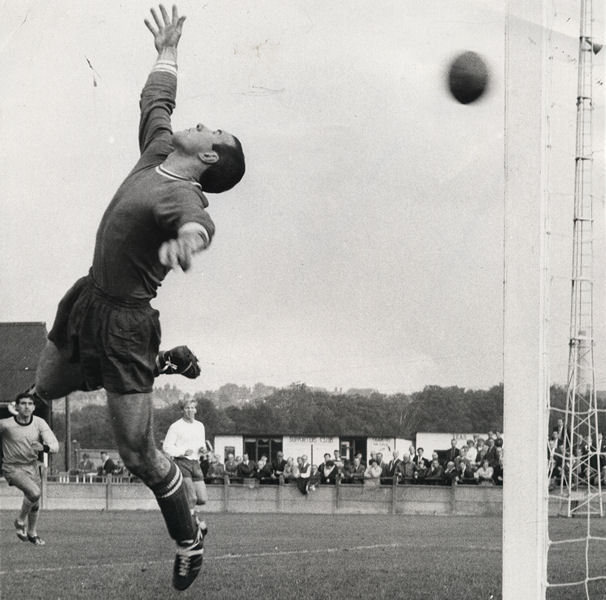 Brian Hughes is beaten as Phil Amato (left) and Ken Bracewell (right) look on.