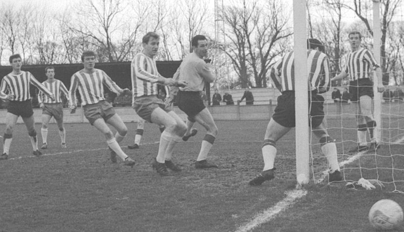 From left to right John Ballagher, Arthur Blackley and Dennis Randall watch the ball go wide.