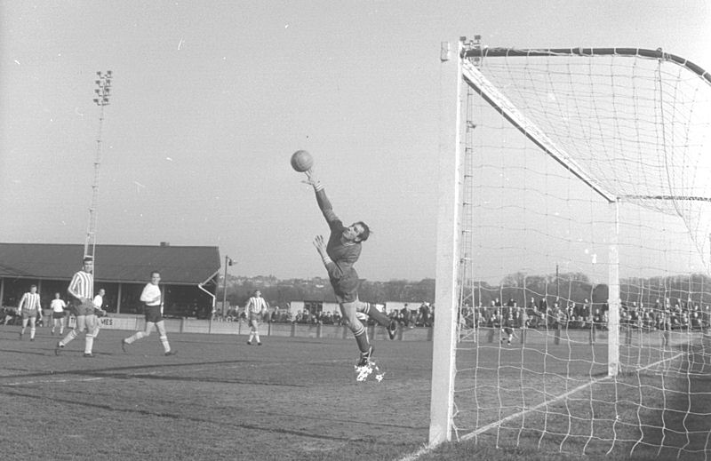 Brian Hughes tips the ball away as Bob Harrop looks on.