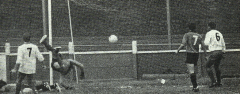 Craig Godden dives but is beaten for the visitors second goal, Steve Dudley (7) and Richard Hemmings (6) are also in the picture.